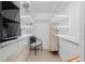 Walk-in closet with shelving and a chair at 1701 Beach Rd # 207, Englewood, FL 34223