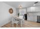 Cozy dining area featuring white accents, modern lighting, and stylish décor, perfect for Gathering gatherings at 1730 Bluebird Ln, Englewood, FL 34224