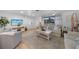 Bright living room features neutral tones, comfortable seating, a decorative rug, and stylish decor at 1730 Bluebird Ln, Englewood, FL 34224