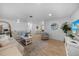 Bright living room featuring neutral colors, comfortable seating, and stylish decor with wood flooring at 1730 Bluebird Ln, Englewood, FL 34224