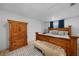 Bedroom with wood furniture, soft rug, and plenty of natural light at 1730 Bluebird Ln, Englewood, FL 34224