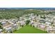 Aerial shot of a cozy neighborhood near a lake and lush green space at 1730 Bluebird Ln, Englewood, FL 34224