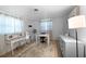 Bright office space with a desk, vanity, wood-look flooring, and natural light at 1730 Bluebird Ln, Englewood, FL 34224