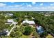 Aerial view of property showcasing well-maintained landscaping, fencing, and the house itself at 1733 Belvidere Rd, Englewood, FL 34223