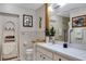 Bright bathroom featuring a vanity, mirror and ladder for towels at 1733 Belvidere Rd, Englewood, FL 34223