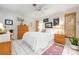 Cozy bedroom with light walls, tile floor, and natural light at 1733 Belvidere Rd, Englewood, FL 34223