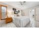 Bright bedroom with natural light, tile floor and access to ensuite bathroom at 1733 Belvidere Rd, Englewood, FL 34223