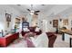 Inviting living room with a comfortable leather sofa, decorative accents, and an open layout at 1733 Belvidere Rd, Englewood, FL 34223