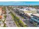 Charming coastal town with palm tree-lined streets, shops and restaurants under blue skies at 1784 Bayshore Dr, Englewood, FL 34223