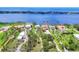 Stunning aerial view of the neighborhood with waterfront properties and boat docks at 1784 Bayshore Dr, Englewood, FL 34223
