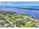 Panoramic aerial view of waterfront homes and lush surroundings of the community at 1784 Bayshore Dr, Englewood, FL 34223
