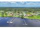 Stunning aerial view of waterfront homes with private docks on a scenic bay at 1784 Bayshore Dr, Englewood, FL 34223