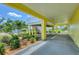 Large covered carport area underneath a home, offering ample space and protection from the elements at 1784 Bayshore Dr, Englewood, FL 34223