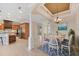 Open concept dining area with view of the kitchen, and chandelier at 1784 Bayshore Dr, Englewood, FL 34223