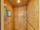Home elevator with call button and wooden interior at 1784 Bayshore Dr, Englewood, FL 34223