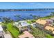 Beautiful waterfront home with lush landscaping, private dock, and serene water views at 1784 Bayshore Dr, Englewood, FL 34223