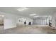 Huge garage with concrete floors and space for multiple cars, golf carts, and plenty of storage at 1784 Bayshore Dr, Englewood, FL 34223