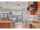 Open kitchen with granite countertops, modern appliances, and a seamless flow to the dining area at 1784 Bayshore Dr, Englewood, FL 34223