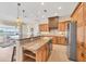 Gourmet kitchen features granite countertops, stainless steel appliances, and an island with seating at 1784 Bayshore Dr, Englewood, FL 34223