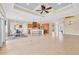 Open-concept living space featuring a kitchen island, dining area, and beautiful architectural details at 1784 Bayshore Dr, Englewood, FL 34223