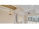 Bright living room featuring lots of natural light and view of the lake at 1784 Bayshore Dr, Englewood, FL 34223