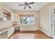 Office featuring custom cabinets and a large window with a water view at 1784 Bayshore Dr, Englewood, FL 34223