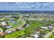 An aerial view of the neighborhood, golf course and lakes surrounding the property at 200 Arlington Dr, Placida, FL 33946