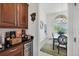 Dining area with wood cabinets, a wine cooler, and a table for six at 200 Arlington Dr, Placida, FL 33946