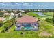 A beautiful house has a screened-in pool that overlooks the neighborhood golf course and pond at 200 Arlington Dr, Placida, FL 33946
