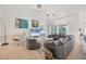 Spacious living room with modern decor, a comfortable gray couch, and plenty of seating at 200 Arlington Dr, Placida, FL 33946