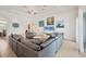 Bright and airy living room featuring tile floors, neutral decor, and a comfortable seating arrangement at 200 Arlington Dr, Placida, FL 33946