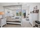 Spacious main bedroom featuring a four-poster bed, plush carpet, and ample natural light from sliding glass doors at 200 Arlington Dr, Placida, FL 33946