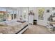 Bright main bedroom with a four-poster bed and sliding doors leading to a balcony with a view of the outdoors at 200 Arlington Dr, Placida, FL 33946