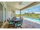 Covered patio with dining table and pool view at 200 Arlington Dr, Placida, FL 33946