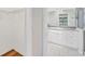Bathroom with white cabinets, granite countertop, and a view of the pool at 2106 Damascus Ln, Punta Gorda, FL 33983