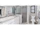 Bathroom featuring a white vanity, updated faucet, enclosed shower, and toilet at 2106 Damascus Ln, Punta Gorda, FL 33983