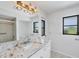 Bright bathroom with granite countertops, a white vanity, and an updated faucet at 2106 Damascus Ln, Punta Gorda, FL 33983