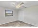 Neutral bedroom featuring laminate flooring, a ceiling fan, and a large closet at 2106 Damascus Ln, Punta Gorda, FL 33983