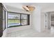 Dining room with large glass windows overlooking the backyard at 2106 Damascus Ln, Punta Gorda, FL 33983