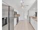 Bright kitchen featuring white cabinets, tile flooring, and stainless steel appliances and stone countertops at 2106 Damascus Ln, Punta Gorda, FL 33983