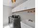 Functional laundry room features modern washer, dryer, sink, and ample cabinet storage at 2106 Damascus Ln, Punta Gorda, FL 33983