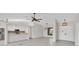 Open-concept living room with a large window, tile flooring, and a doorway leading to the kitchen at 2106 Damascus Ln, Punta Gorda, FL 33983