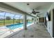 Screened pool area with fans and outdoor TV, perfect for entertaining and relaxation at 2106 Damascus Ln, Punta Gorda, FL 33983