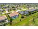 Aerial view highlighting a home with a screened pool, lovely landscaping, and clear property boundaries at 25 Mariner Ln, Rotonda West, FL 33947