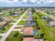 Bird's-eye view of home with screened pool, manicured lawn, and clearly marked property boundaries in a residential area at 25 Mariner Ln, Rotonda West, FL 33947