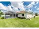 View of the backyard and the screened in pool area at 25 Mariner Ln, Rotonda West, FL 33947