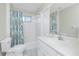 Bathroom with a white vanity, a shower and bathtub combination, and a decorative curtain at 25 Mariner Ln, Rotonda West, FL 33947