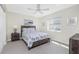 Cozy bedroom with a comfortable bed, ceiling fan, and ample natural light at 25 Mariner Ln, Rotonda West, FL 33947