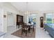 Elegant dining room with chandelier, glass doors to the pool, and classic furnishings at 25 Mariner Ln, Rotonda West, FL 33947