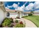 A beautiful home with manicured landscaping and a charming fountain, showcasing its inviting exterior and serene atmosphere at 25 Mariner Ln, Rotonda West, FL 33947